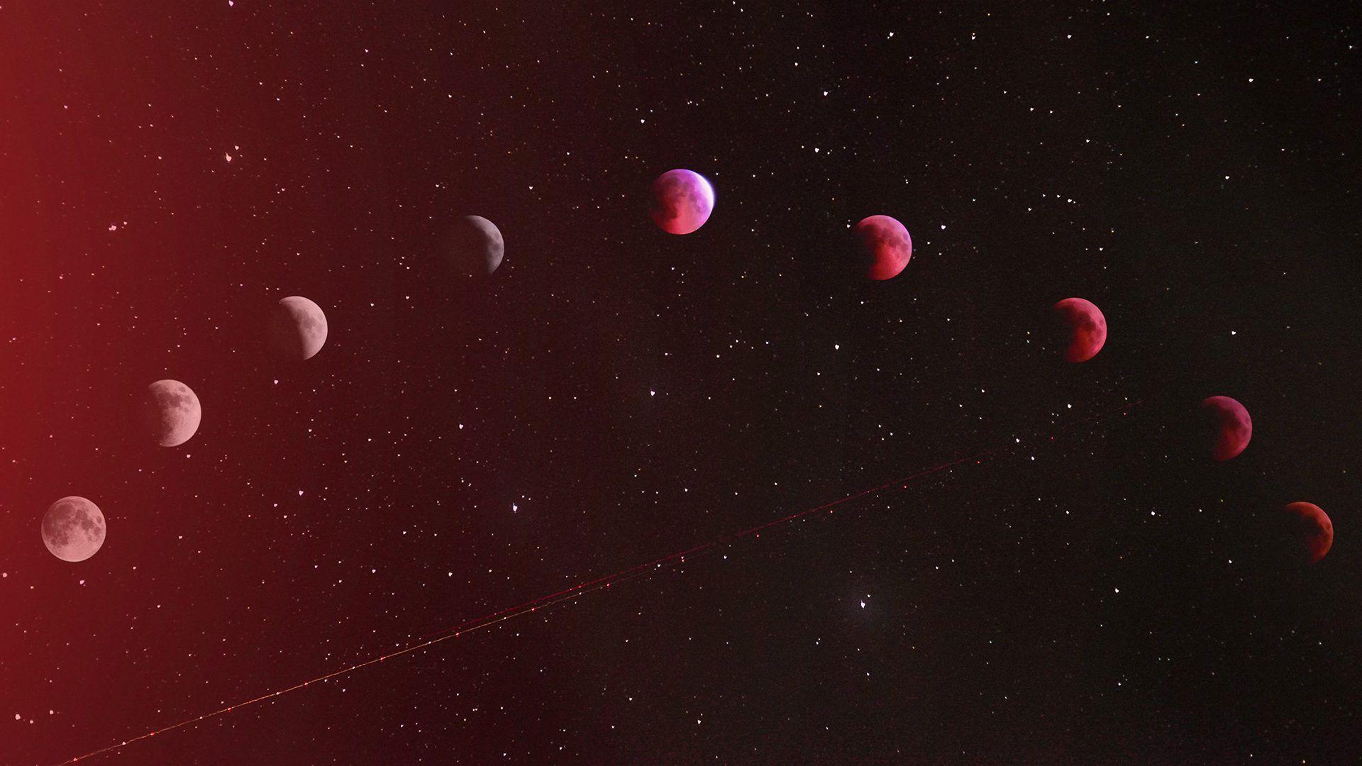 Composite image showing different phases of a lunar eclipse against a starry sky.